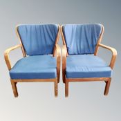 A pair of mid century beech framed armchairs