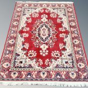 A machine made Persian rug 198 cm x 140 cm