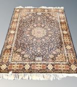 A machine made Tabriz design rug 196 cm x 143 cm