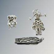 Three silver charms