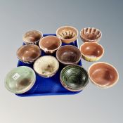 A tray of glazed terracotta bowls with slip ware decoration