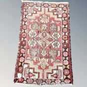 An Eastern hearth rug 85 cm x 49 cm