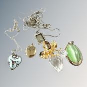 A collection of brooches,