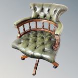 A Chesterfield green buttoned leather desk armchair