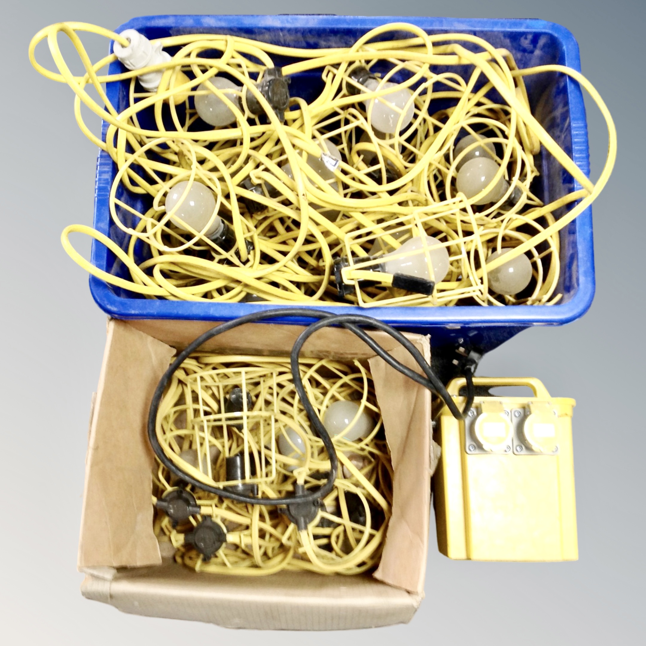 A 110v transformer together with two boxes containing cable site lights