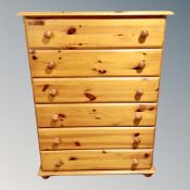 A contemporary pine six drawer chest