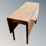 A 19th century mahogany drop leaf table