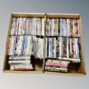 Two boxes containing approximately 100 dvds