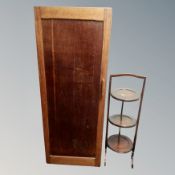A 20th century sentry door cabinet together with a three tier folding cake stand