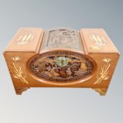 An ornate carved Chinese camphor wood box with brass lock