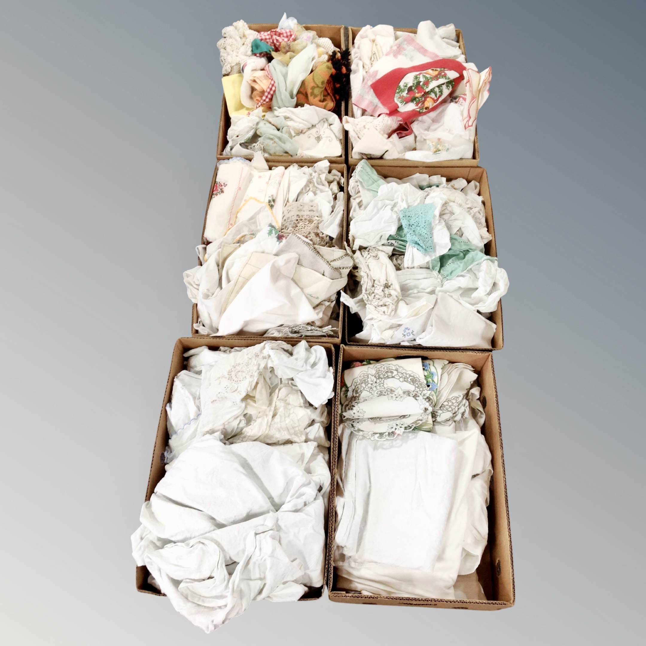 Eight boxes of vintage linens