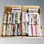 Two boxes containing approximately 100 dvds