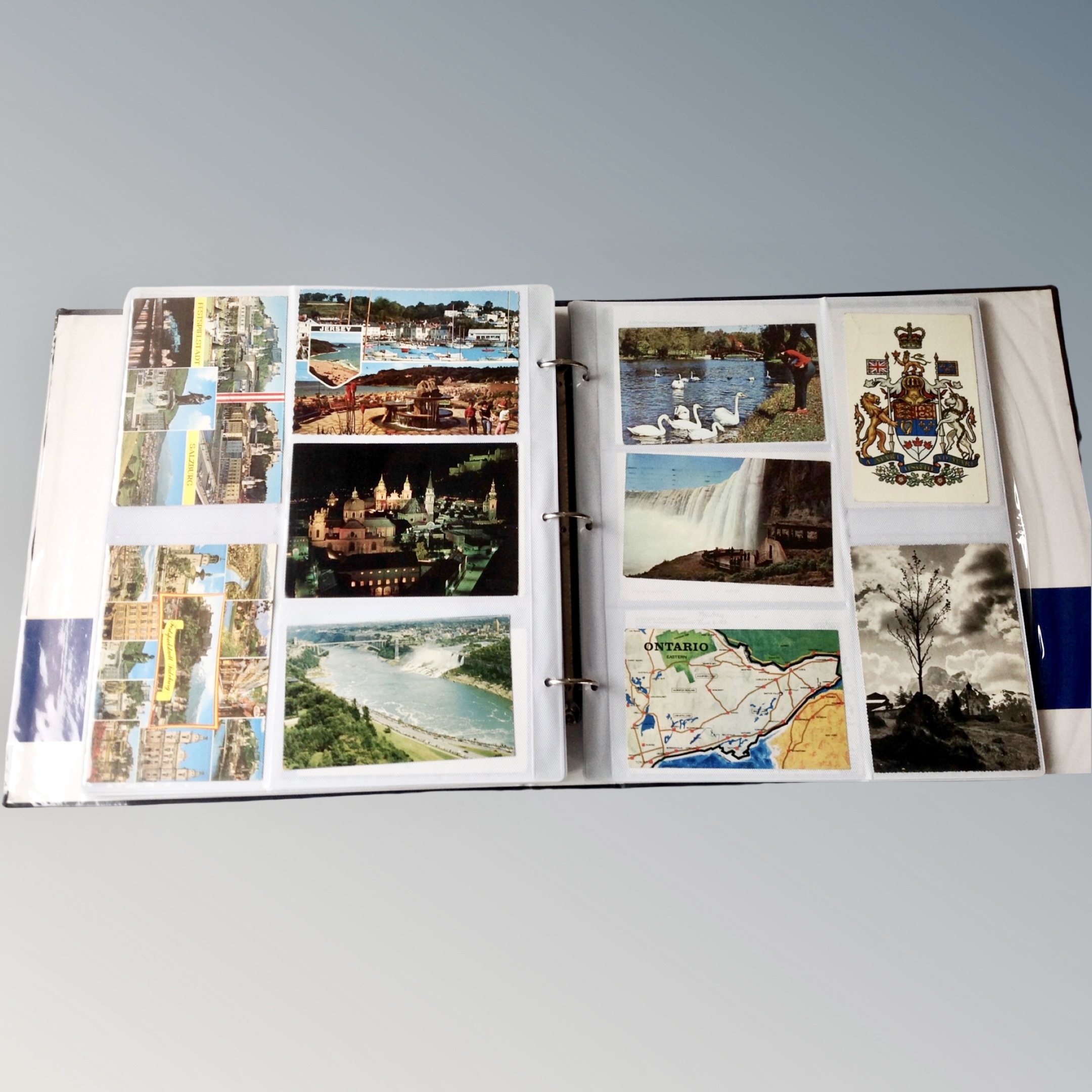 An album of colour and monochrome postcards