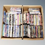 Two boxes containing approximately 100 dvds