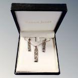 A McIntosh design silver pendant on chain with matching earrings