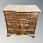 A Georgian style mahogany serpentine fronted cabinet fitted a drawer with slide on bracket feet,