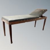 An early 20th century Doctor's examination bed by C J Hewlett and Sons London