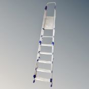 An Abru 8-tread folding aluminium ladder with hand rails