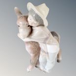 A Lladro figure - Marcelino boy hugging Donkey no 1181