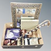 A box of two walking sticks with metal badges, vintage cameras, cased cutlery,