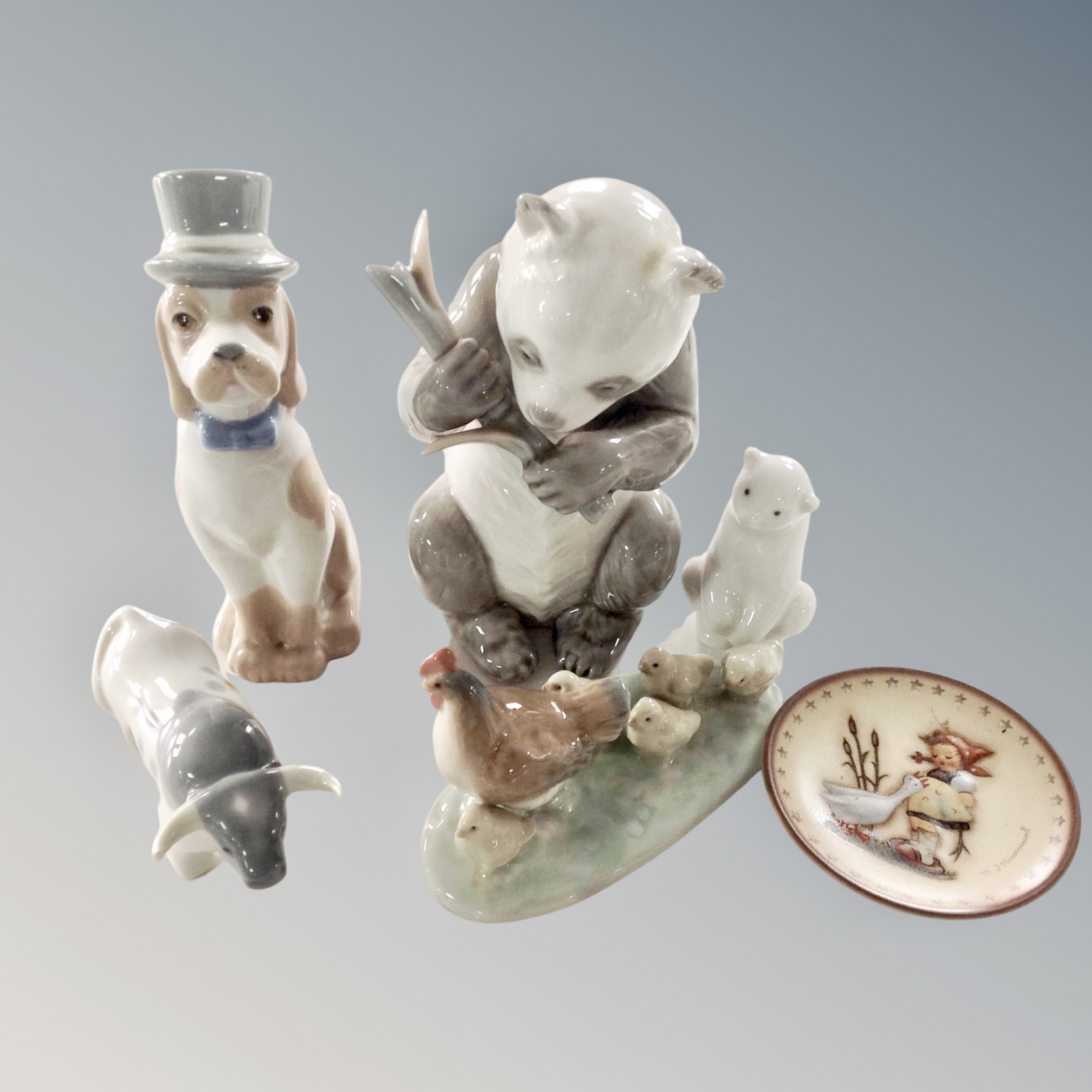 Four Nao figures : chicken family, polar bear cub, horned cow, panda with bamboo,