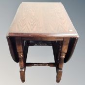 A contemporary heavy oak gateleg table