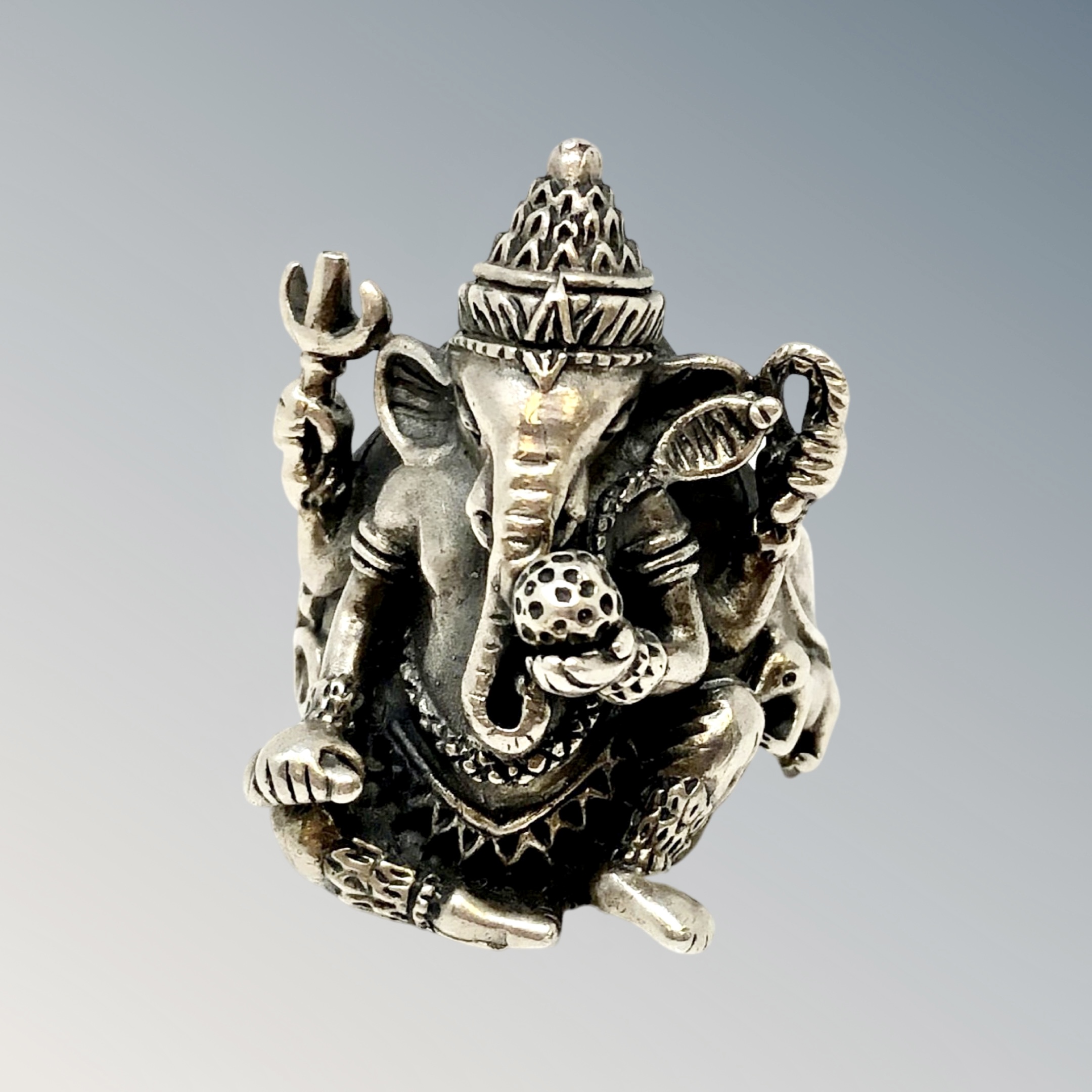 A large silver ring depicting Ganesha, size T.