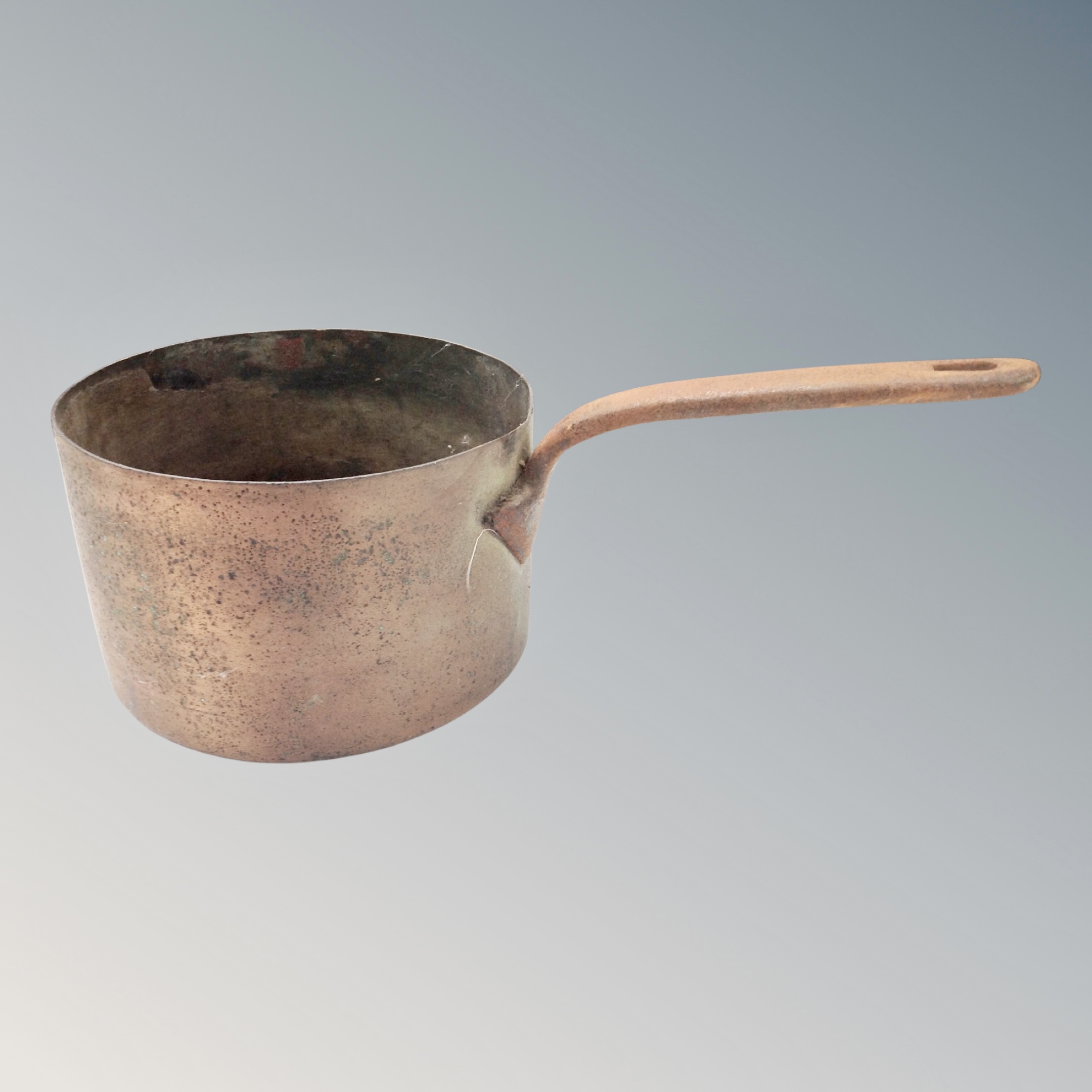 A 19th century cast iron handled cooking pan
