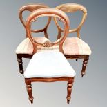 A pair of Victorian balloon backed chairs together with a further balloon backed chair (3)