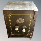 An antique cast iron safe by S Withers and Company of West Bromwich, fitted with internal drawer,