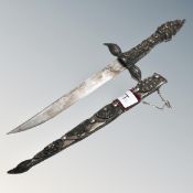 A Persian dagger in ornate sheath