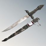 A Persian dagger in ornate sheath