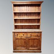 A Victorian pine kitchen dresser fitted with drawers
