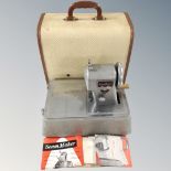 A vintage Seam Maker model SM9 sewing machine with original booklets in case.