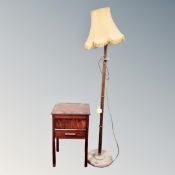 A mid century sewing box on raised legs together with beechwood standard lamp with shade