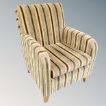 A contemporary armchair in striped fabric