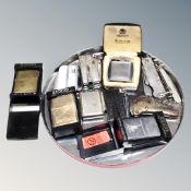 A collection of eight pocket lighters, Zippo, Marlbro, New York Statue of Liberty, Ronson, Calibri,