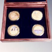 A set of four 24ct gold plated End of WWII commemorative coins in case