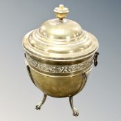 A Victorian decorative brass lidded coal urn on raised feet