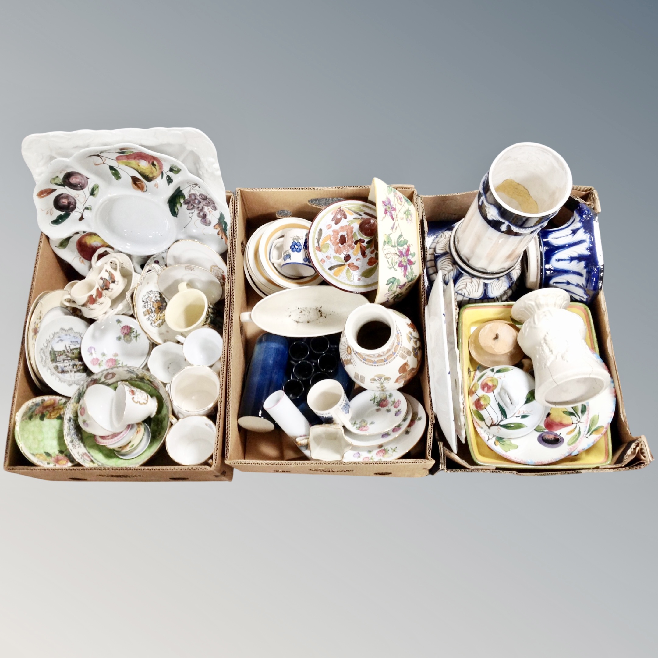 Three boxes of antique and later ceramics, commemorative tankards, serving trays, dishes,