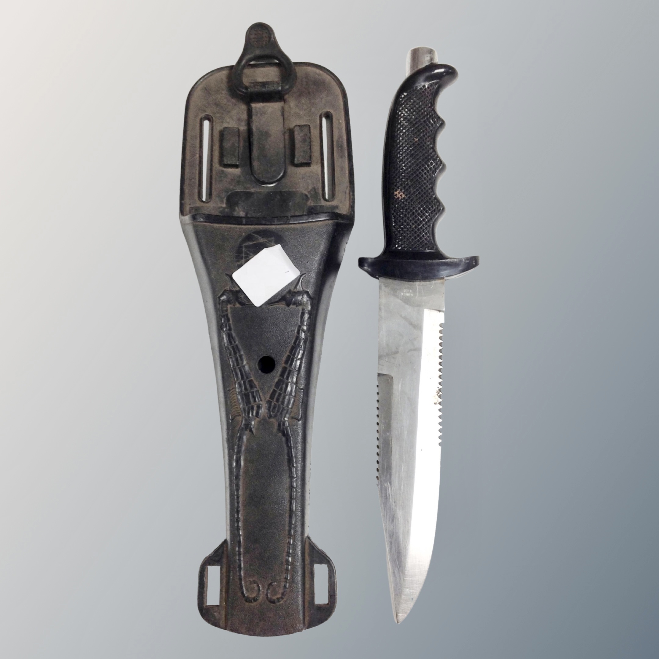 A knife in holster with belt