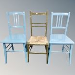A pair of Edwardian painted bedroom chairs together with a further rush seated painted chair
