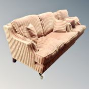 A good quality two-piece lounge suite comprising of two-seater settee and armchair in red and