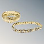 A gold plated bangle together with an encrusted bracelet