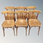 A set of six bentwood dining chairs together with a further bentwood armchair.