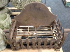 A Victorian cast iron fire grate