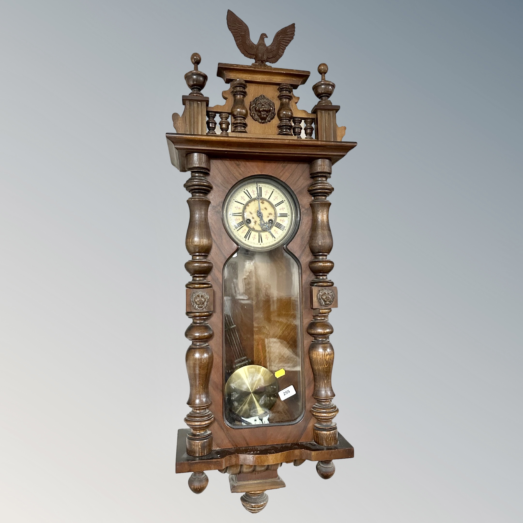 A 19th century Vienna wall clock surmounted by an eagle