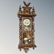 A 19th century Vienna wall clock surmounted by an eagle