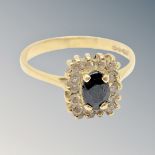 An 18ct gold sapphire and diamond ring, size O/P.