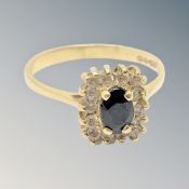 An 18ct gold sapphire and diamond ring, size O/P.